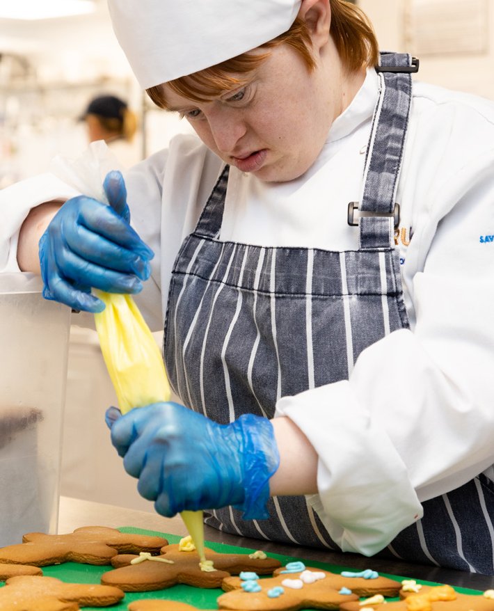 CRUMBS trainee working in the kitchen