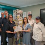 SeeTec Pluss present inclusion award to The Crumbs Project staff team