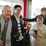 The Crumbs Project trainee works at The Parks Foundation cafe serving hot drinks to customers