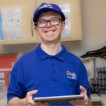 Trainee holding tablet computer